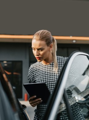 woman looking in the car