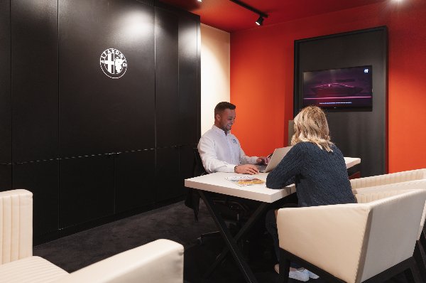 two people sat a desk
