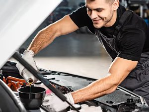 man under the front of car
