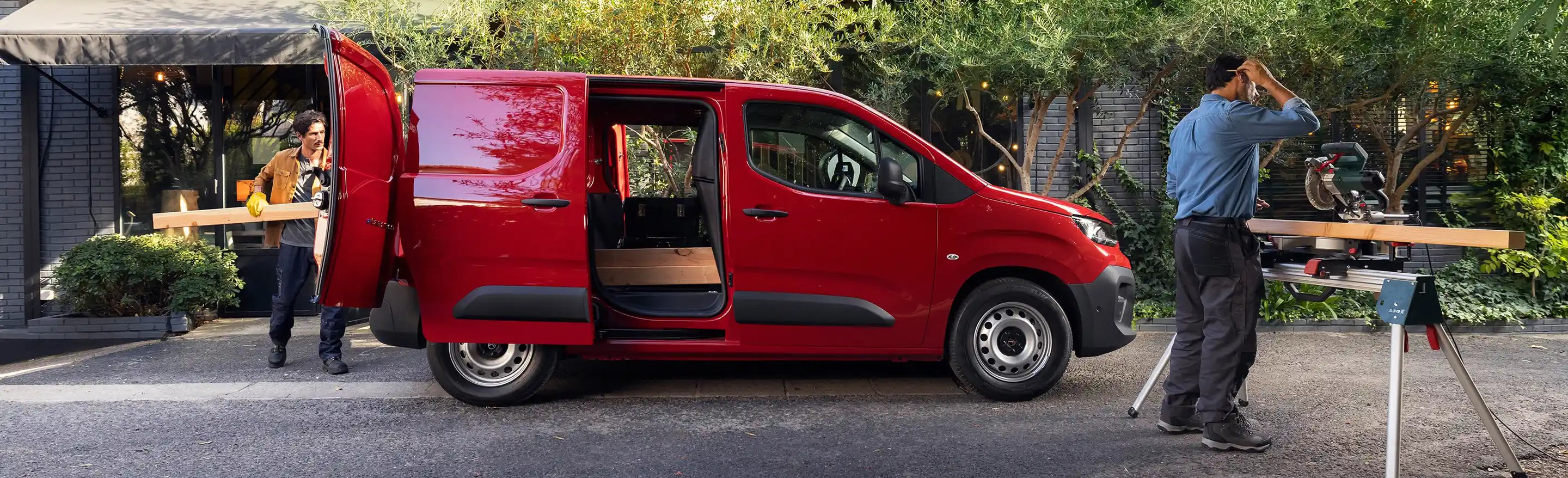 side view of the van where two men are working