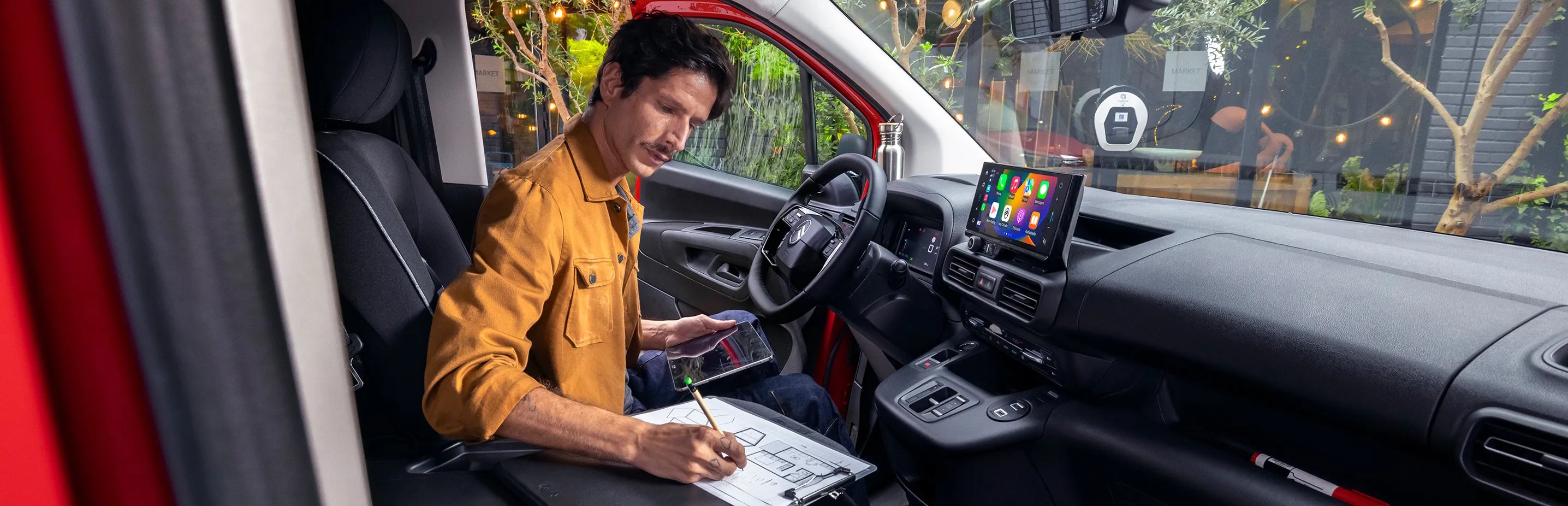 Man sat working in the van