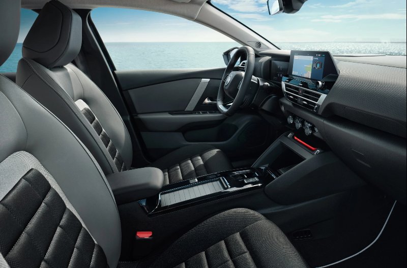 pan of  the view of the front seats of the car
