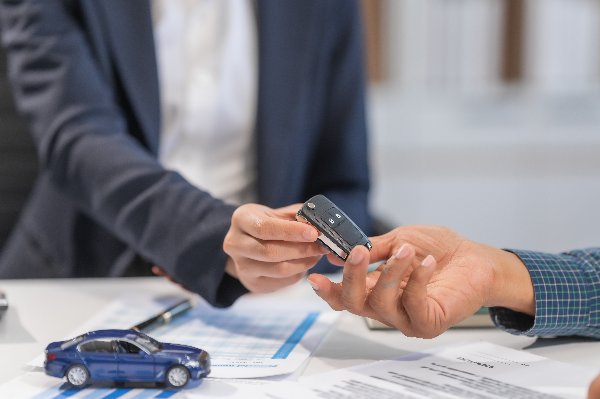 person handing over the keys
