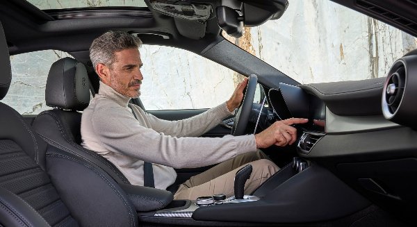 man sat in the front seat of the car
