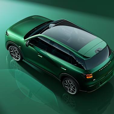 Green SUV viewed from above, showcasing its roof and design details.