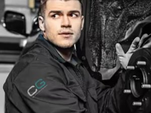 man looking into engine