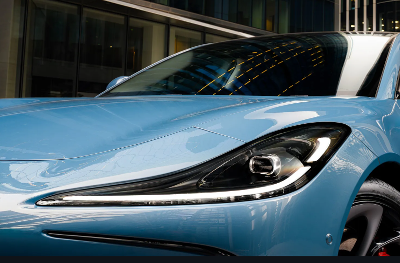 close up of the front of the car and its headlights