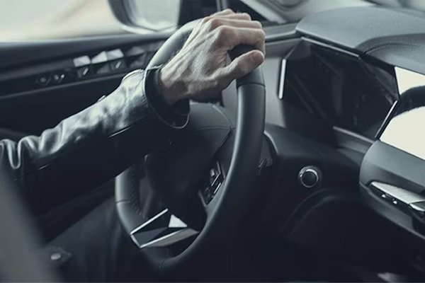 hand on steering wheel
